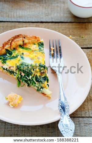 large piece of rustic quiche with salmon, food closeup
