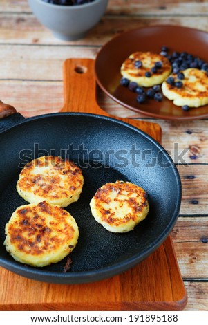 pancakes in a frying pan and on the plate, food closeup