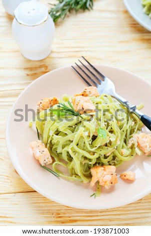 tasty pasta with salmon, food closeup