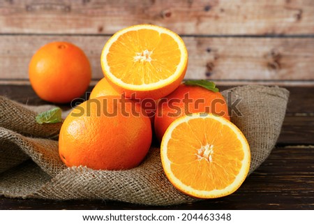 ripe orange cut in half, food closeup