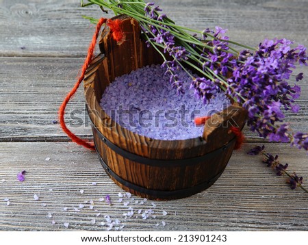 Aromatic bath salt in wooden bucket, herbal