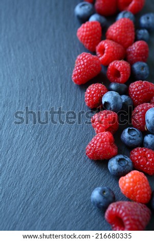 Berry mix on the slate background,  food closeup