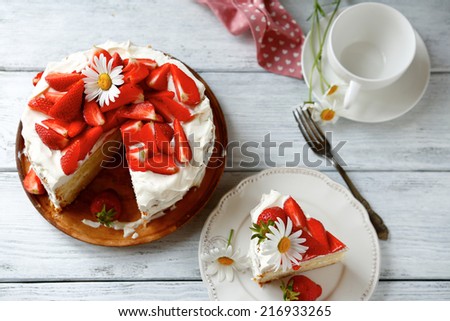 Delicious cake with strawberries, top view