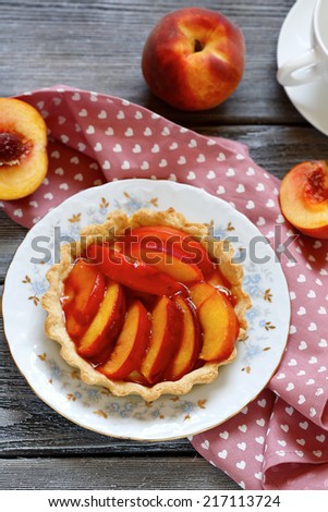 tart with slice of  peach,, top view