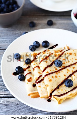 pancakes with chocolate sauce, side view