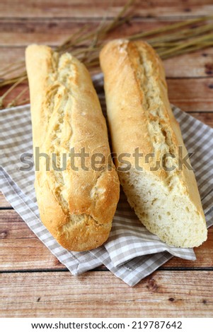 Freshly baked baguettes on wooden boards, healthy food,