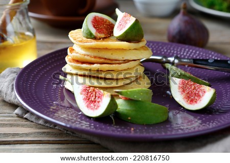 stack of pancakes with figs and honey, food close up