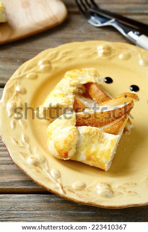 Galette with slices of pears in a bowl, nutritious food