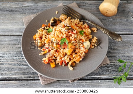 Delicious pilaf with peppers, carrots and tomatoes, nutritious food