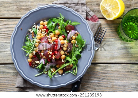 Salad with chickpeas, arugula, food closeup