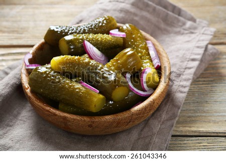 Pickled cucumbers and onions in a bowl, food