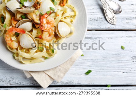 Pasta with delicious shrimp, food top view