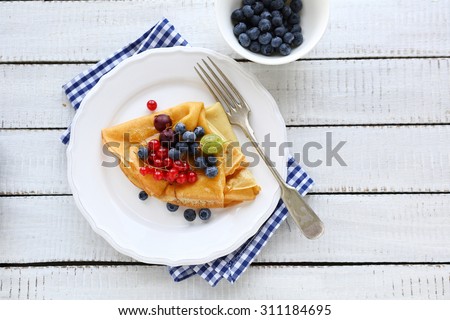 sweet pancakes and berries mix, top view