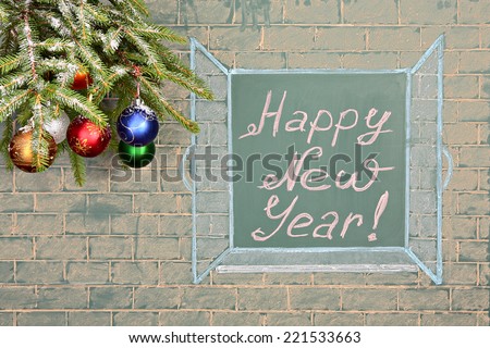 Education concept. Perspectives for the future. Christmas decorations and chalkboard with title: Happy New Year!
