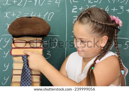 Unusual education concept, schoolgirl and funny parody of teacher from books