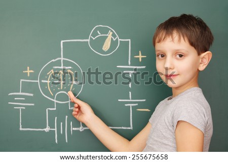Education, little boy learn the basics of electronics