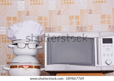 Unusual jesting chef about microwave oven