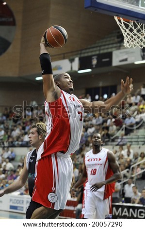 Murcia, Spain - October 19: Chris Moss of CB Murcia dunks the ball during the game against Vive Menorca at Palacio de los Deportes on October 19, 2008 in Murcia, Spain