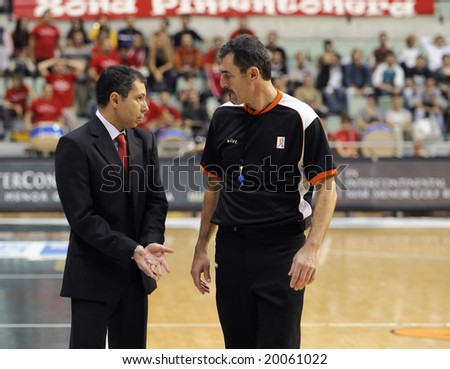 Murcia, Spain - October 19: CB Murcia coach, Manolo Hussein, talks to the referee during the game against Unicaja Malaga at Palacio de los Deportes on October 19, 2008 in Murcia, Spain