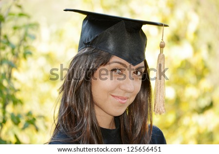 graduation woman portrait smiling and looking happy