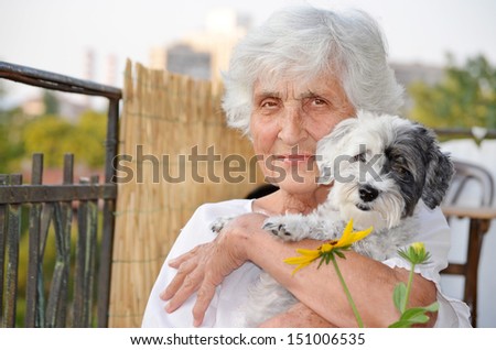 Senior happy woman and dog