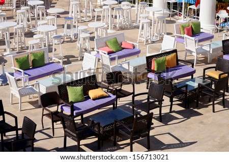 colorful chairs in row in bar