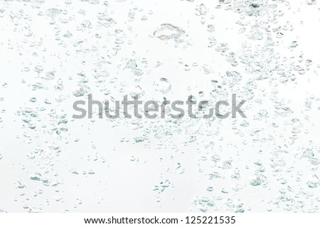 Background of natural air bubbles in the water on a white background