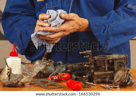Repair of details of automotive engine in the workshop