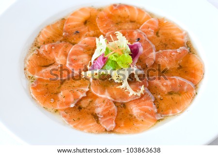 Close up of smoked salmon carpaccio dish.