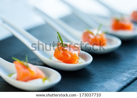 Extreme close up of smoked salmon morsel catering.
