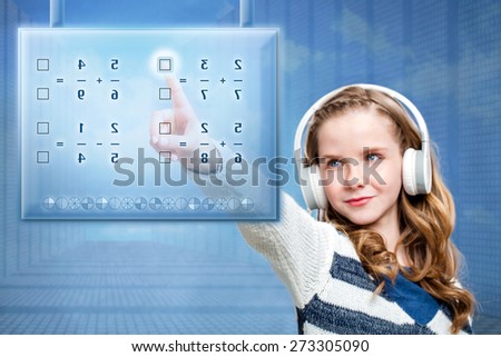 Close up portrait of young female student solving mathematical problem on futuristic digital screen. Conceptual portrait of girl touching screen against blue background.