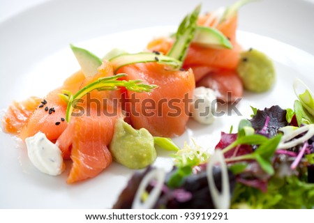 Close up of smoked salmon salad with green asparagus