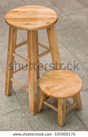 two round top wooden chairs