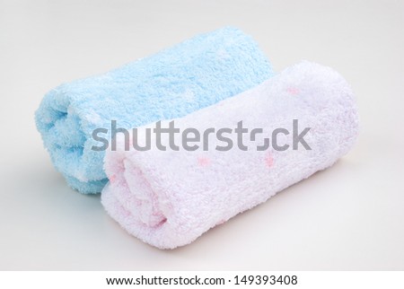 pink and blue towel rolls