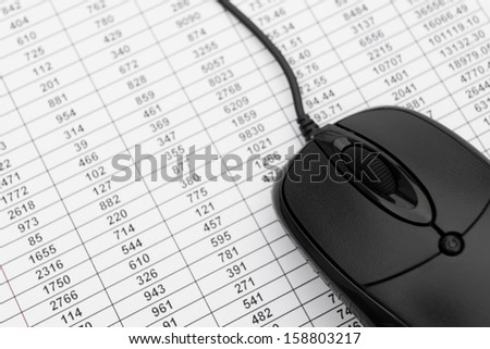 black mouse on data sheet