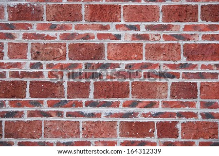 red brick wall, square format