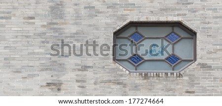 traditional Chinese window and brick wall