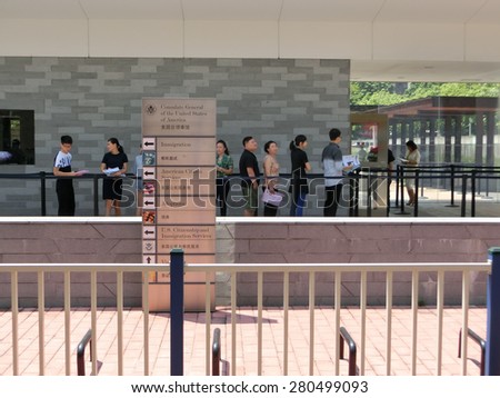 GUANGZHOU, CHINA - September 4 USA consulate on September 4, 2014 in Guangzhou, China. People standing in a queue in front of The Consulate General of United States, applying USA Visas.