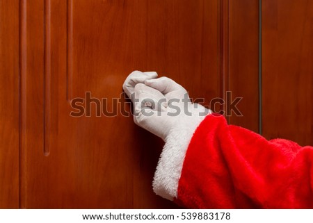 Santa Claus knocking the door