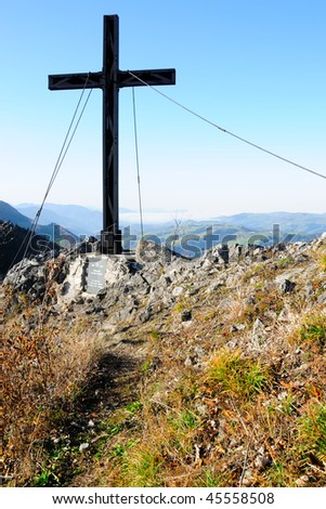 Mountain summit with summit cross on the Haselsteinwand in Lower Austria on a sunny day in autumn