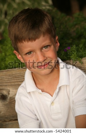 Outdoor portrait of a five year old boy