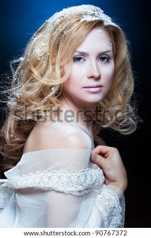 The beautiful blond girl with winter cosmetics