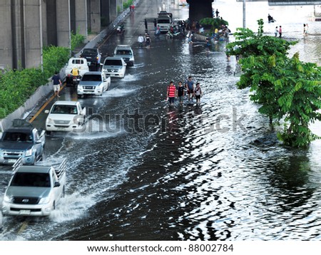 PHATHUMTRANI, THAILAND- OCTOBER 21: Road traffic of the city during the worst monsoon flood in decades on October 21, 2011 Rongsit Road, Phathumtrani, Thailand.