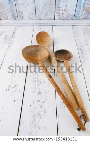 retro kitchen utensils  wood spoon on old wooden table in rustic style