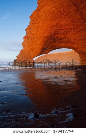 Legzira dramatic natural stone arches reaching over the sea, Atlantic Ocean, Morocco, Africa