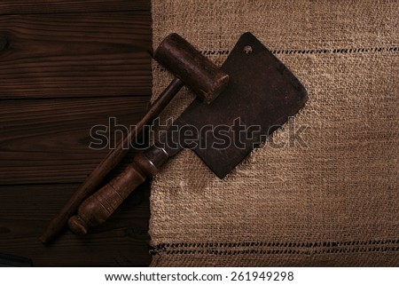 real vintage wooden mallet and iron meat cleaver on old grain sacking linen Completely hand made  handwoven and homespun