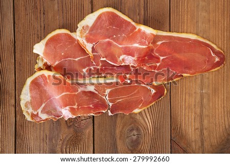 serrano ham jamon Cured Meat on wooden table