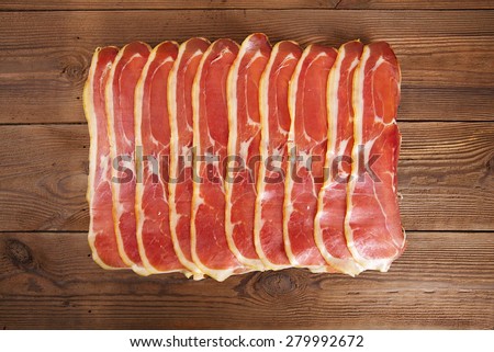 serrano ham jamon Cured Meat on wooden table