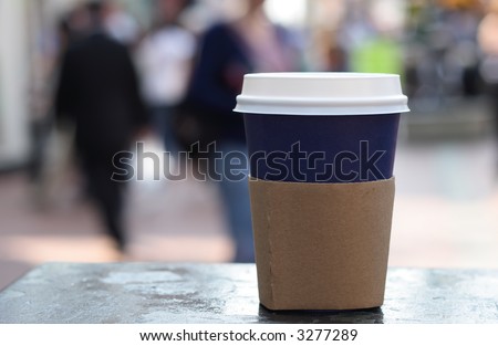 blue cup of coffee on a street background
