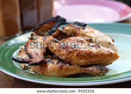 whole grilled chicken on plate